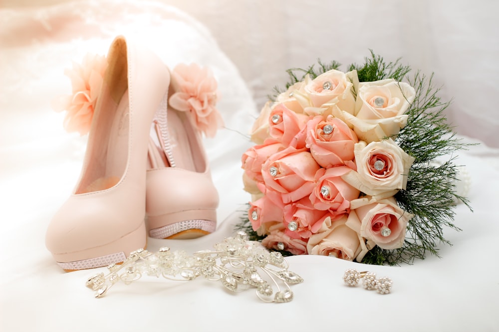 bouquet of flower beside sandals