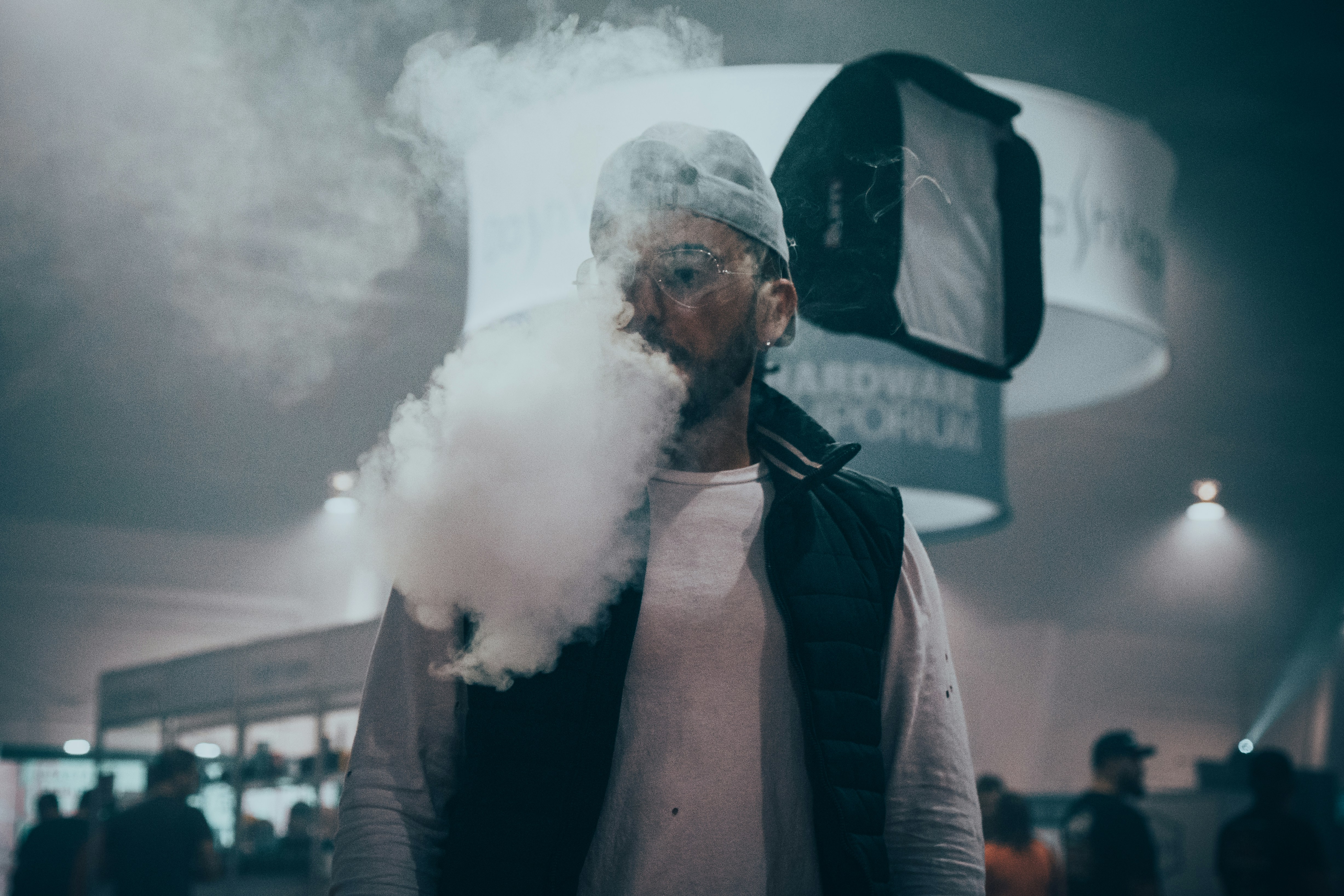 Man blowing out white smoke photo Free Grey Image on Unsplash