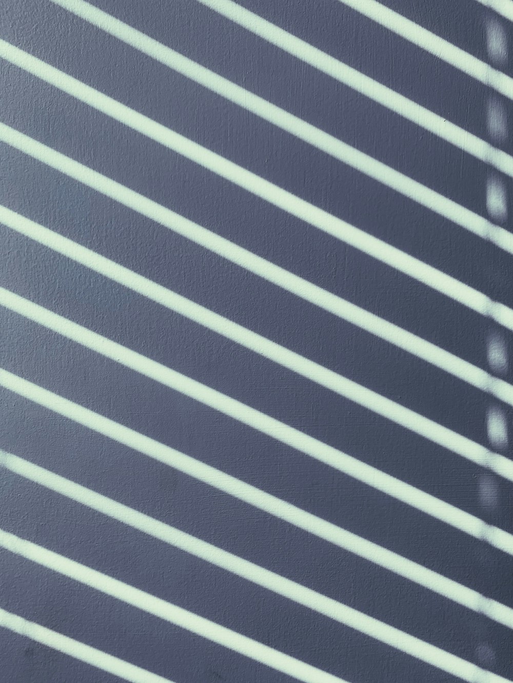 a black and white photo of a window with blinds