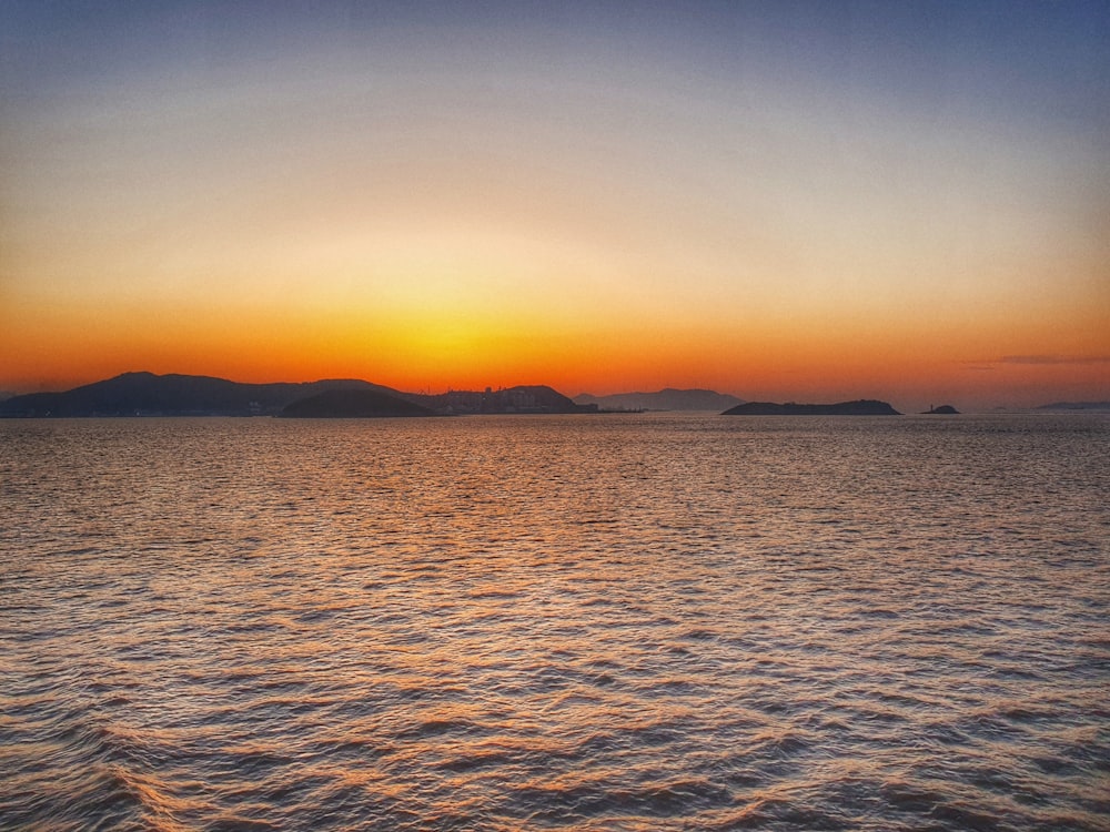 ocean and island during golden hour