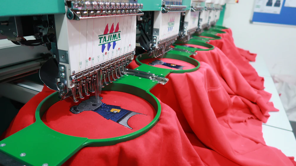 Multi-head embroidery machine running a production batch