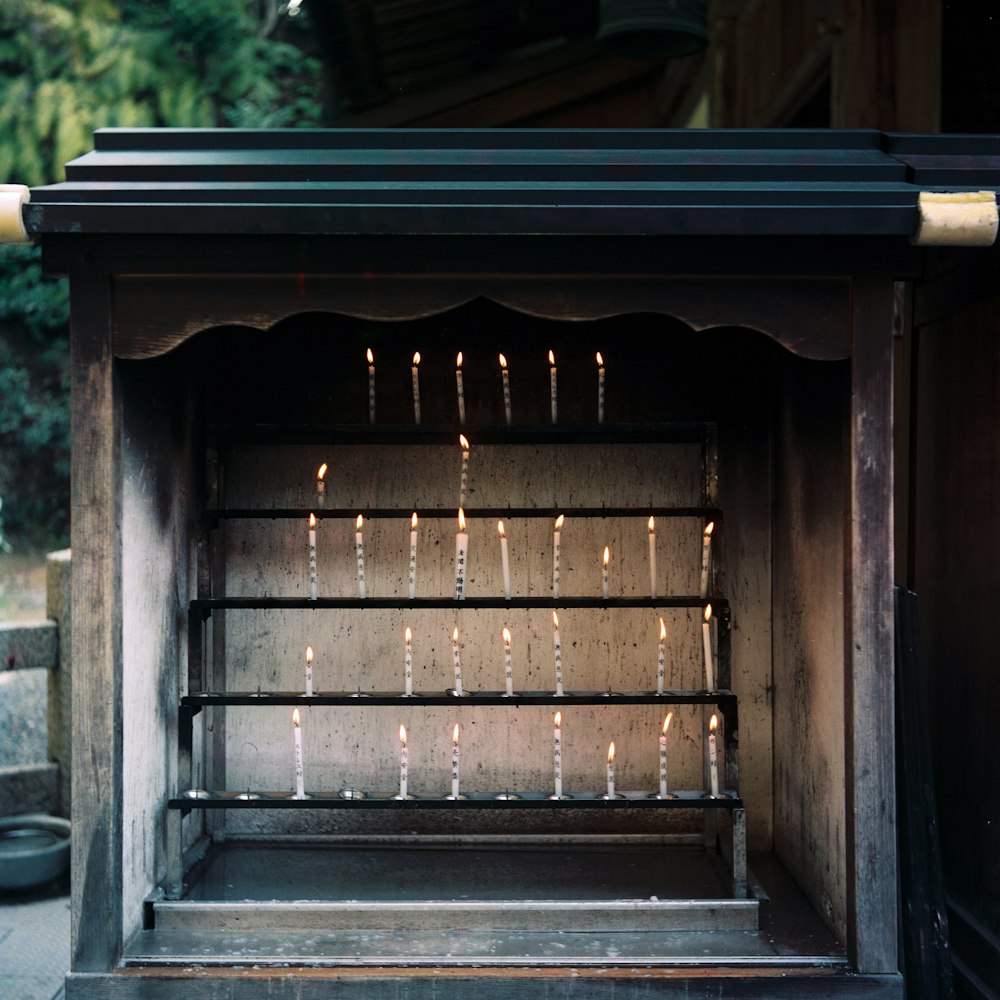 shallow focus photo of lighted white candles