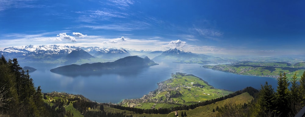 aerial photography of mountains surrounded by sea