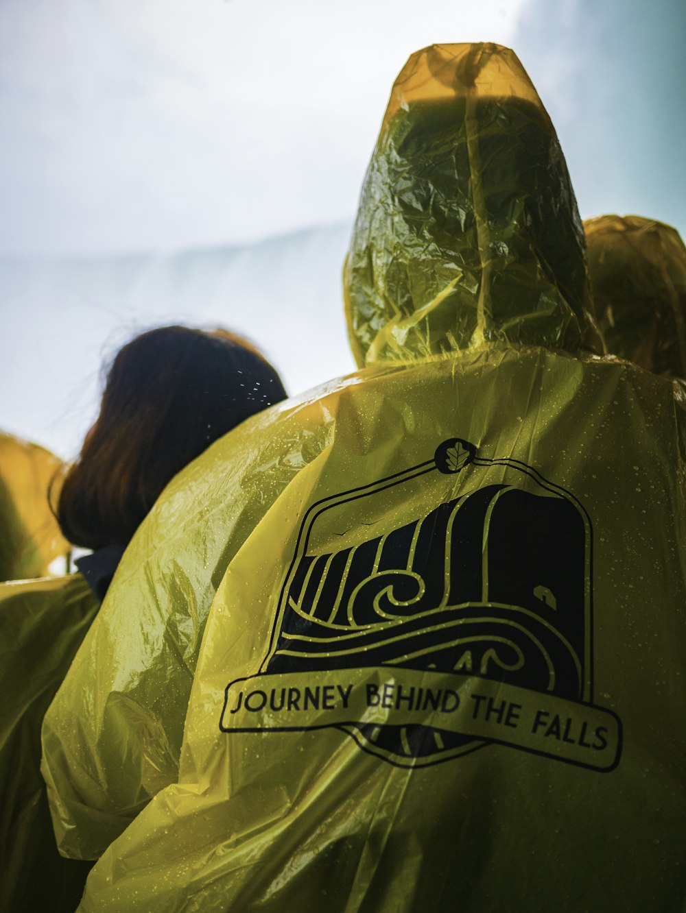 yellow Journey Behind the Falls raincoat