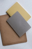 A collection of vedamantraedutech's subject-wise notebooks neatly arranged on a desk.