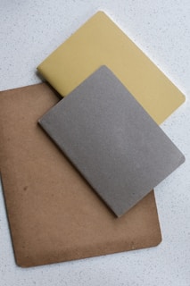 A collection of vedamantraedutech's subject-wise notebooks neatly arranged on a desk.