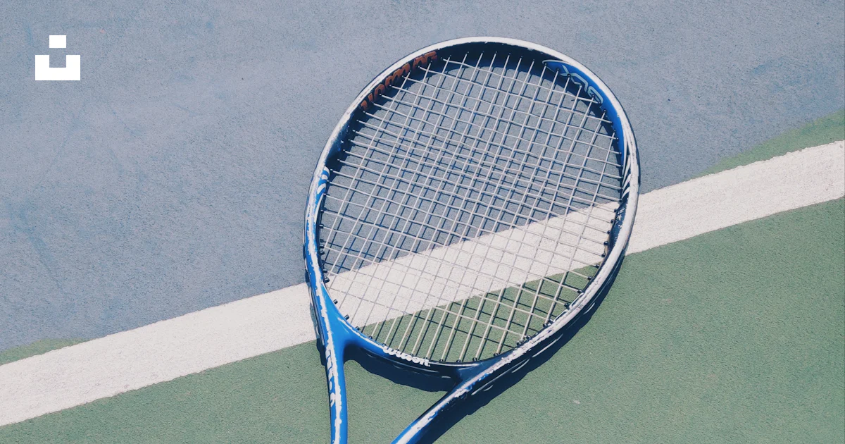 Racket Blue Blue tennis racket on green surface photo – Free Xinbei qu Image on ...