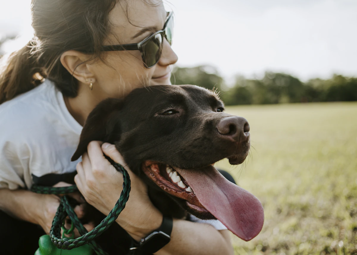 Pet parent sharing a warm moment with her dog