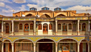 Traditional Melilla architecture featuring intricate tile work and balconies adorned with flowers