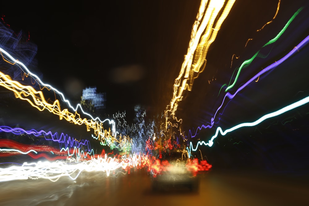 a blurry photo of a city street at night