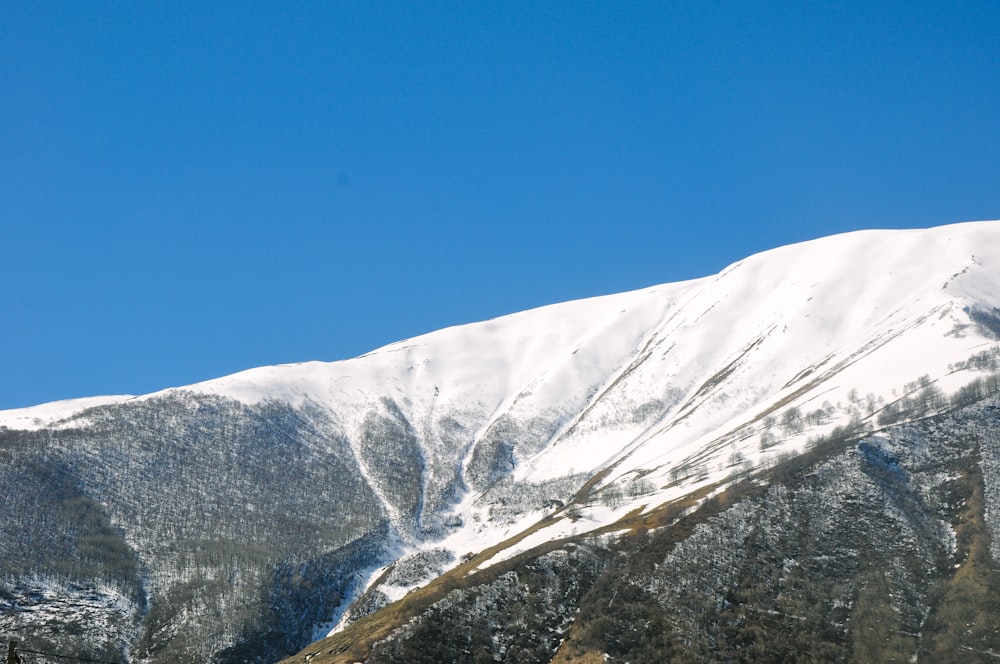 mountain covered with snow during daytime