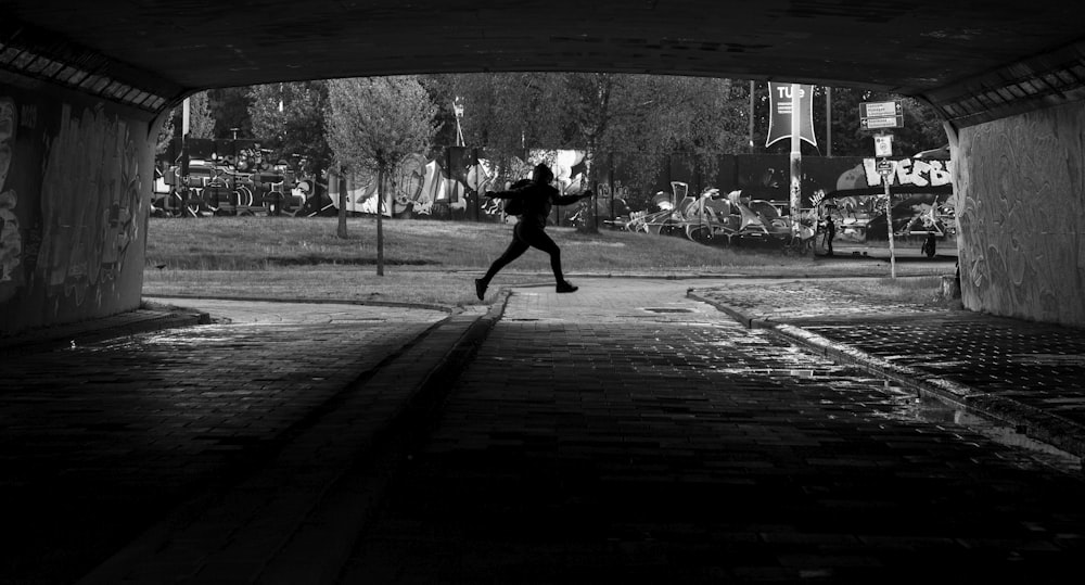 person running on tunnel