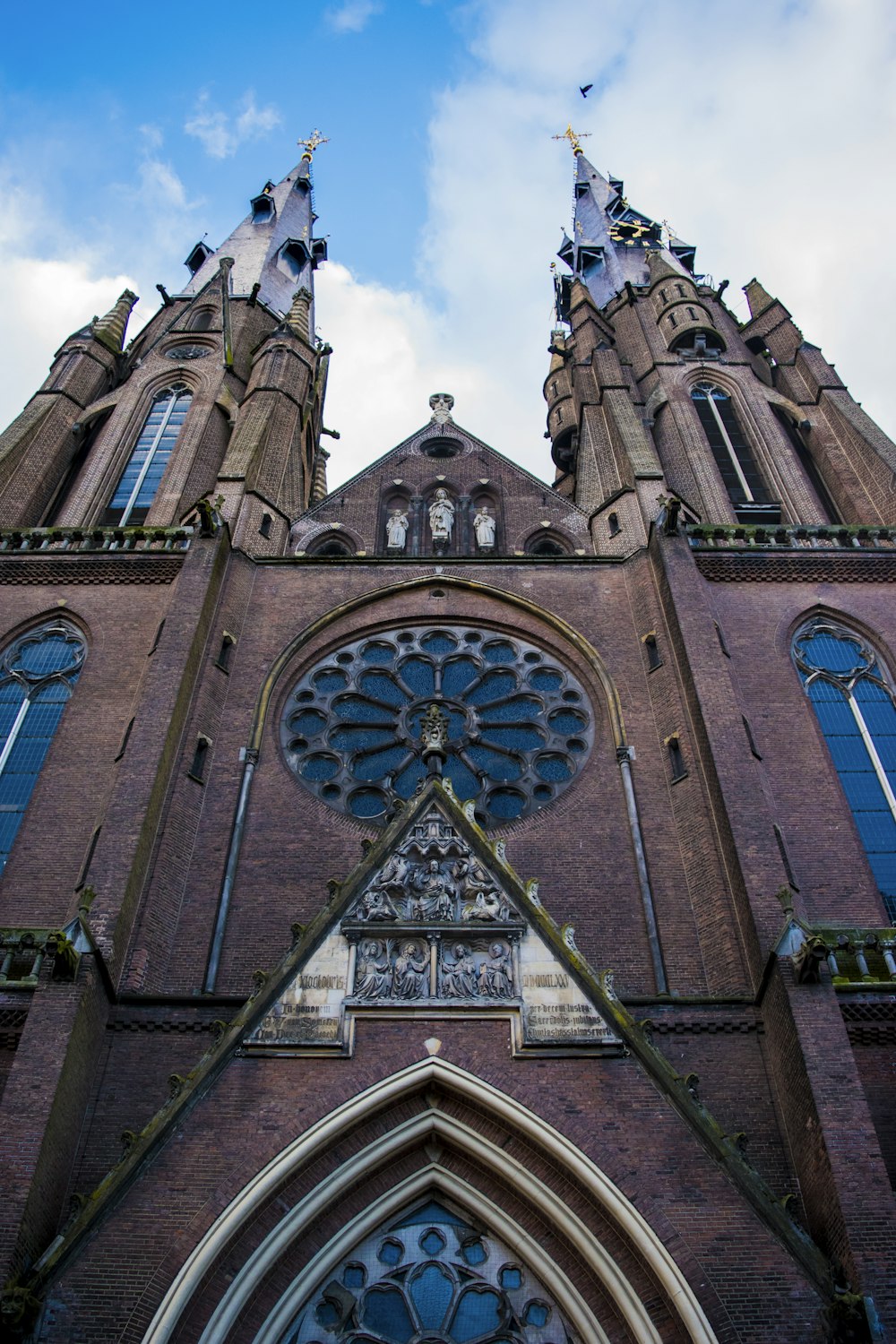 low-angle photography of brown concrete church