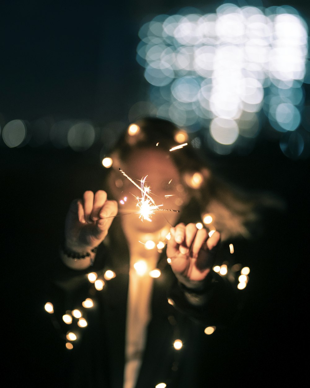 person with sparklers