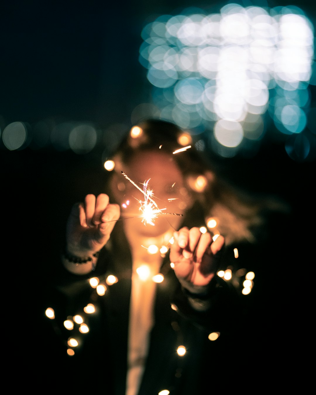 person with sparklers