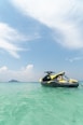 yellow and black personal watercraft on water