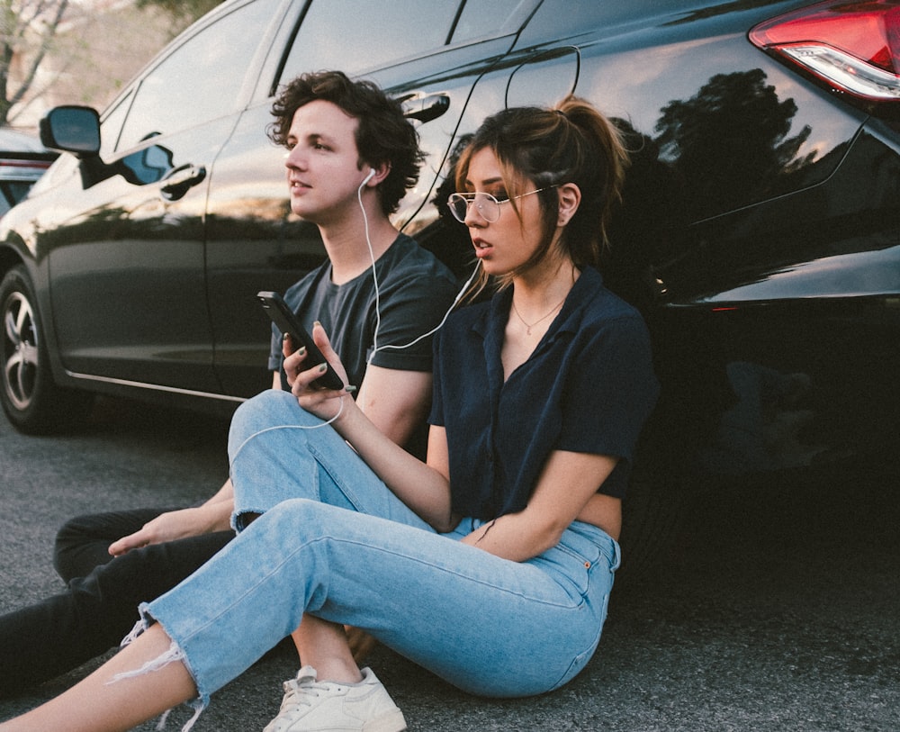 man and woman beside vehicle