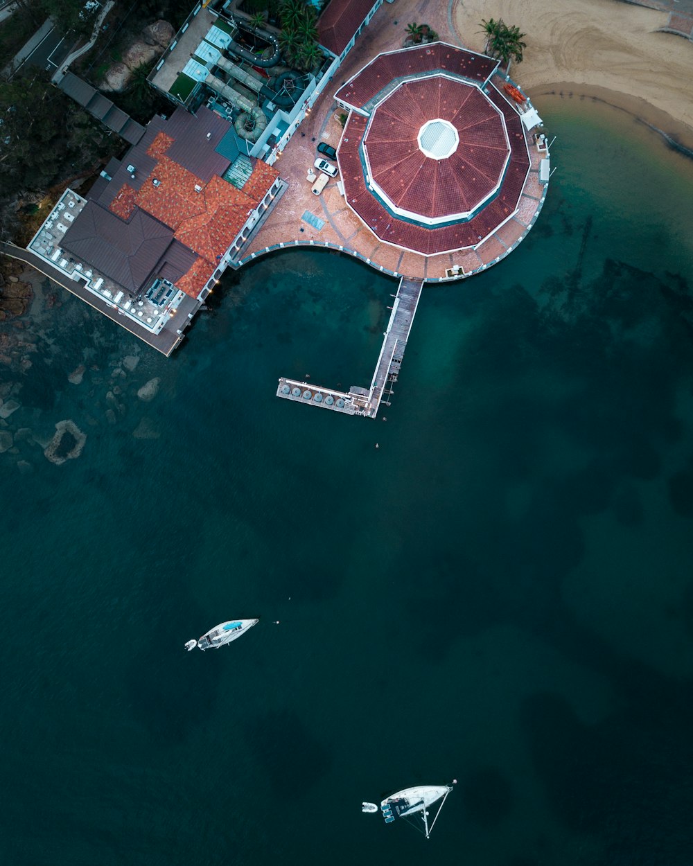 aerial photography of two power boats near building