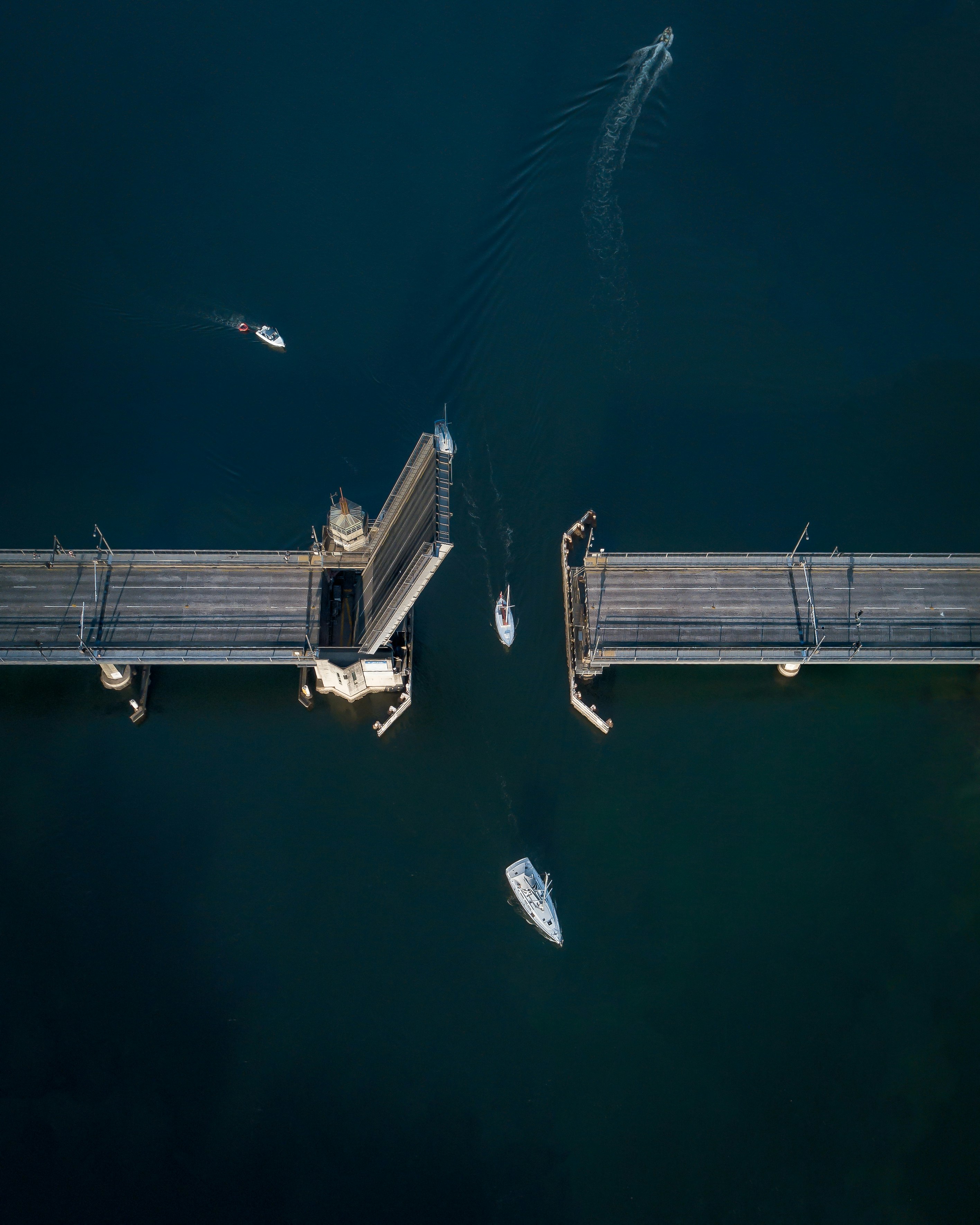 boat crossing on the bridge aerial view