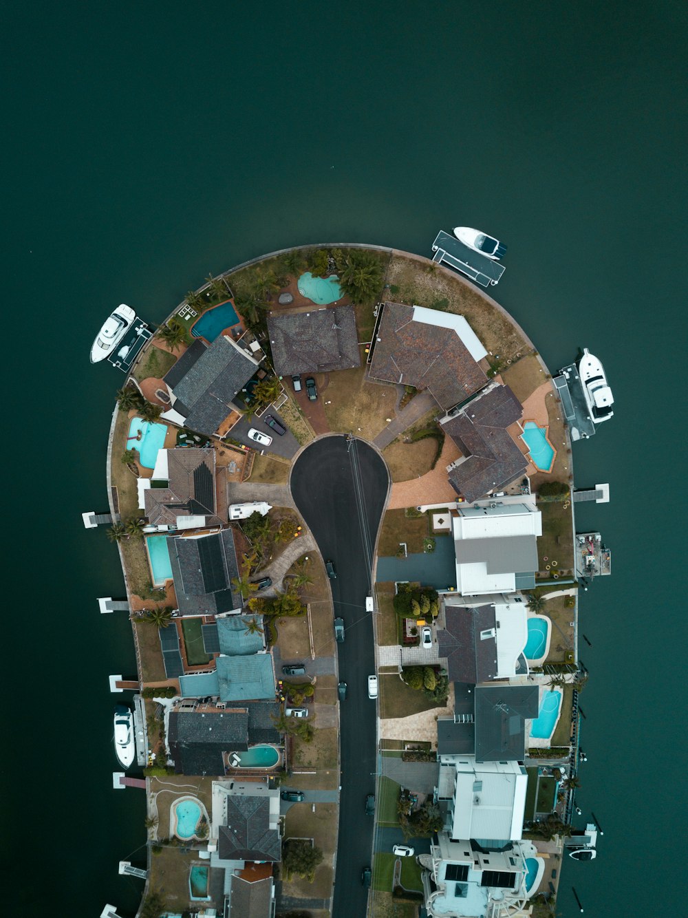 aerial view of island with houses and boats