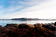 An artistic rendering of the card’s background with calm waters and distant mountains.