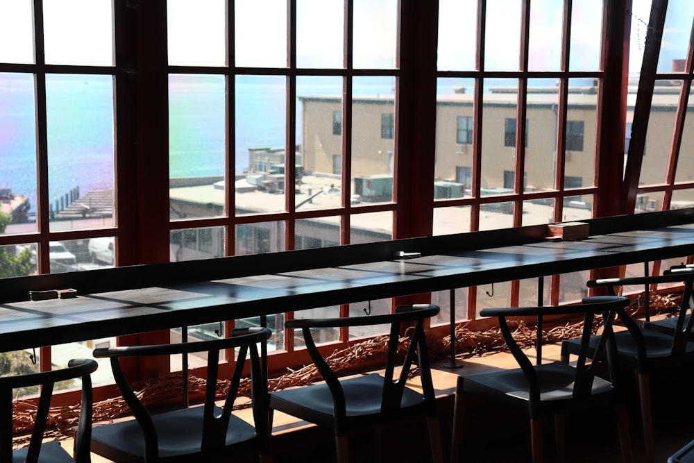 rectangular black table and chairs inside well lit room