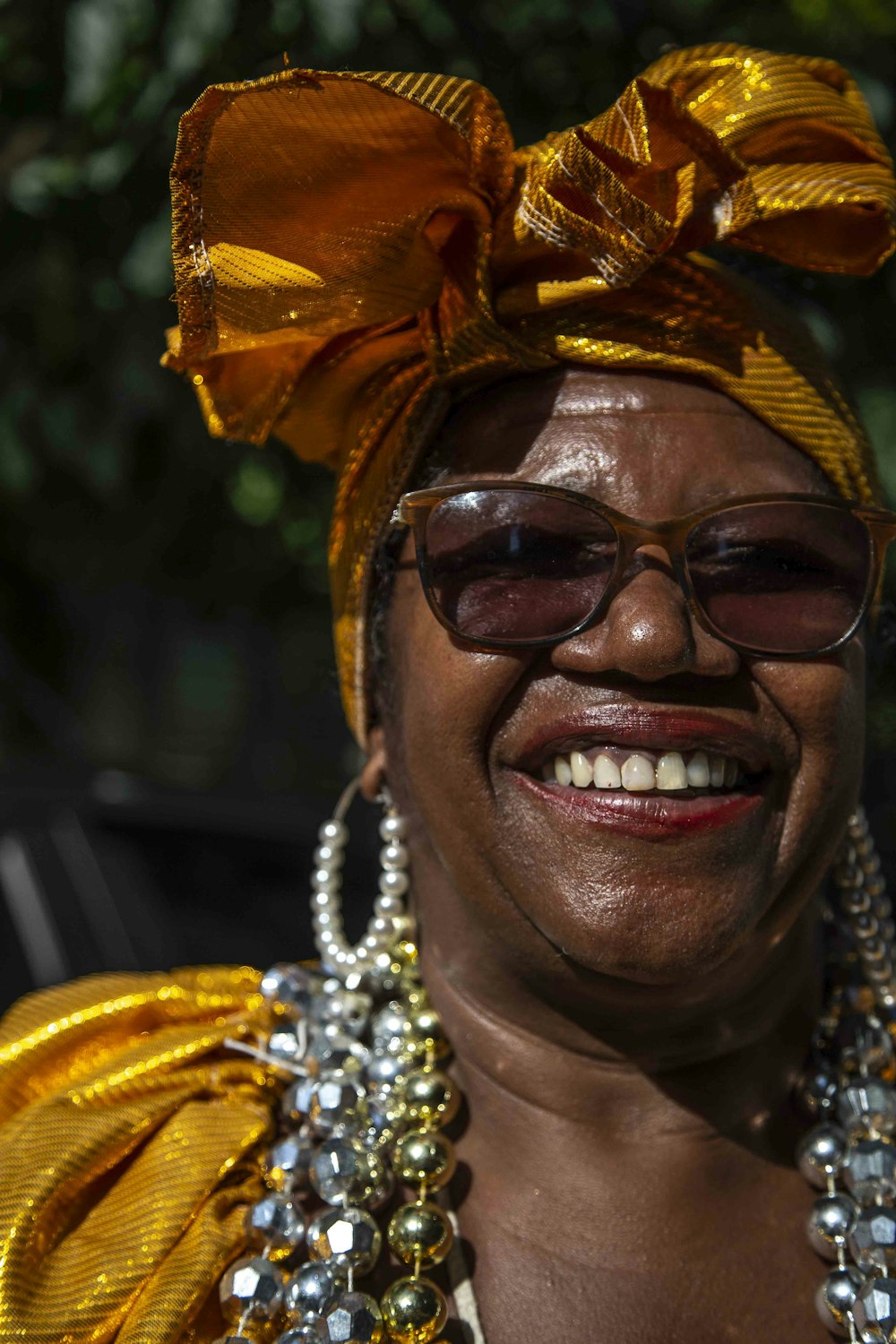 smiling woman wearing brown sunglasses