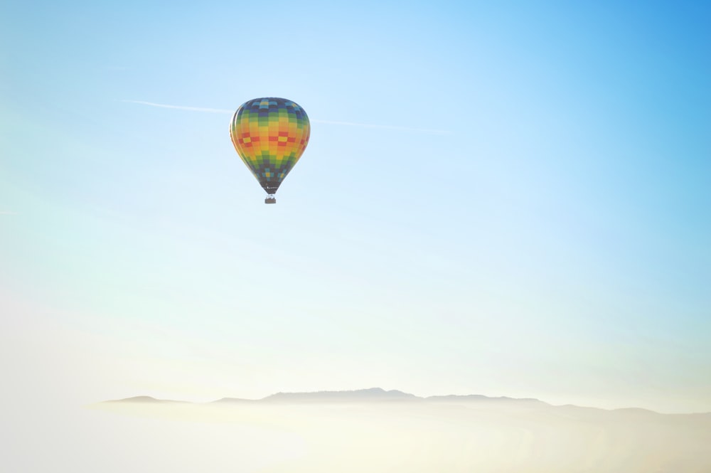 blue, yellow, and red hot air balloon