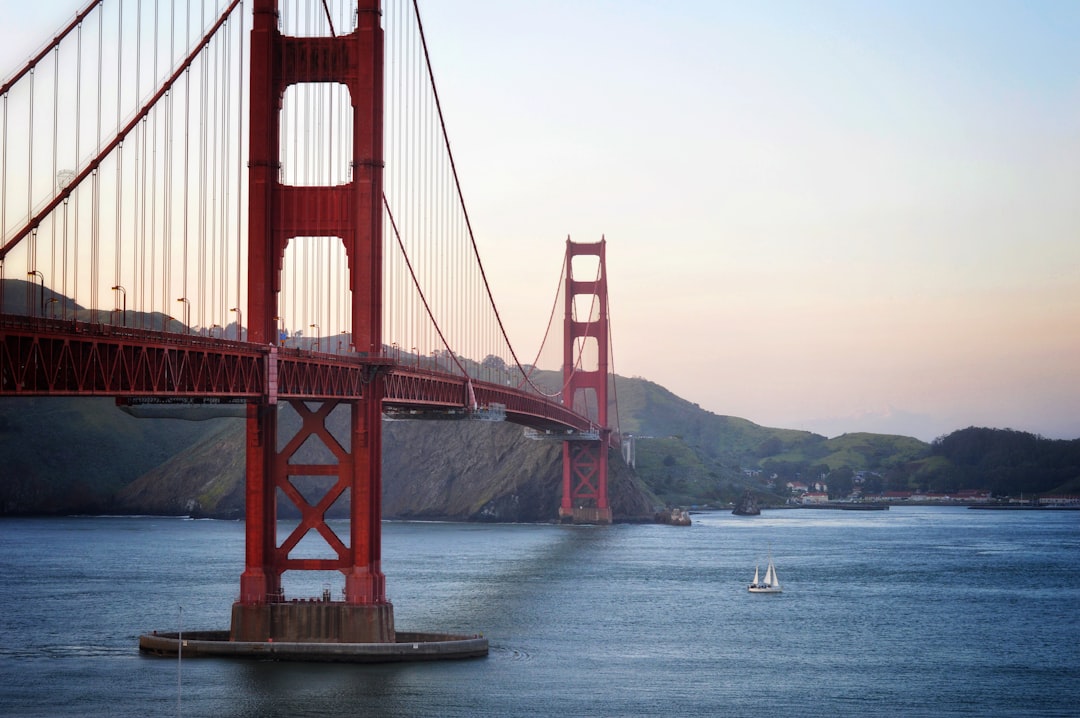 red bridge near ocean