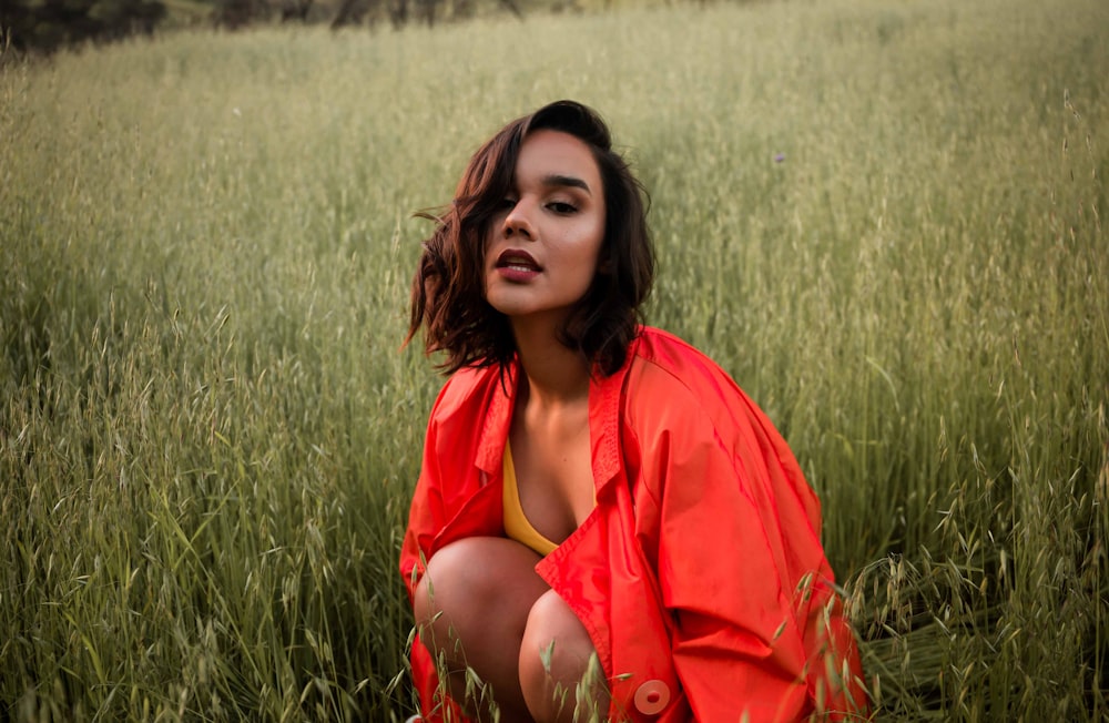 woman wearing orange jacket