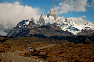 gray vehicle near mountain