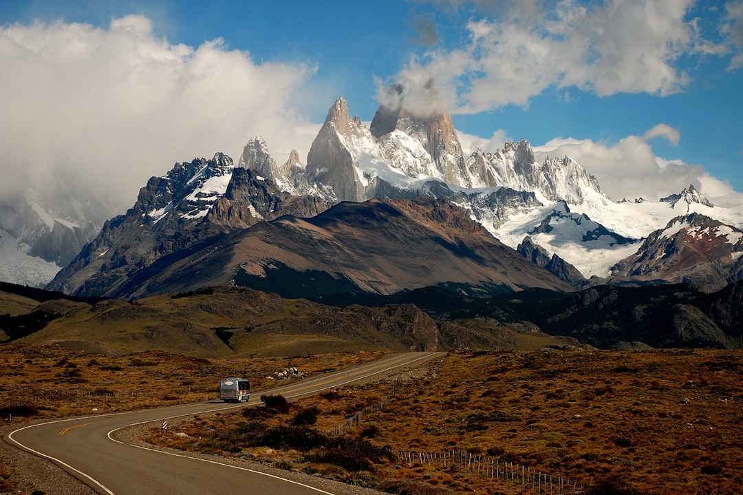 gray vehicle near mountain,