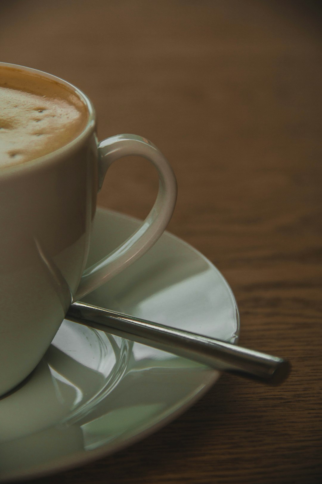 white ceramic cup on saucer