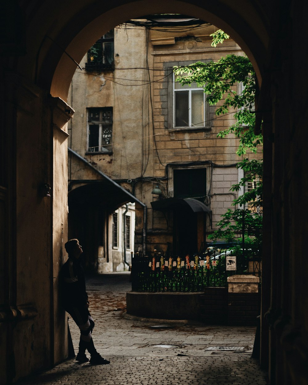 person leaning near doorway