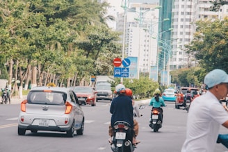 A busy urban street with vehicles smoothly moving, highlighting safe and eco-friendly transport.