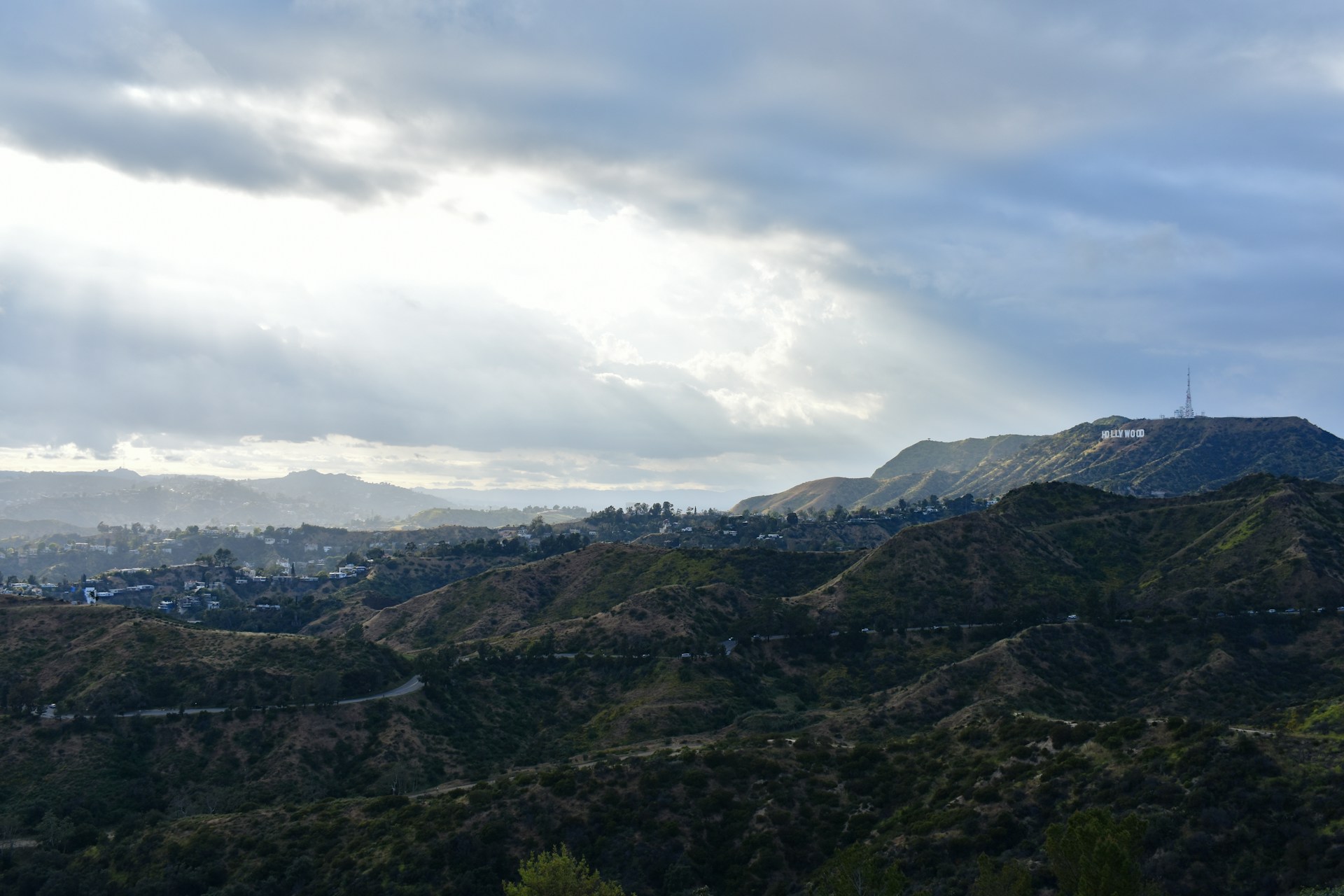 woman wearing yellow long-sleeved dress under white clouds and blue sky during daytime