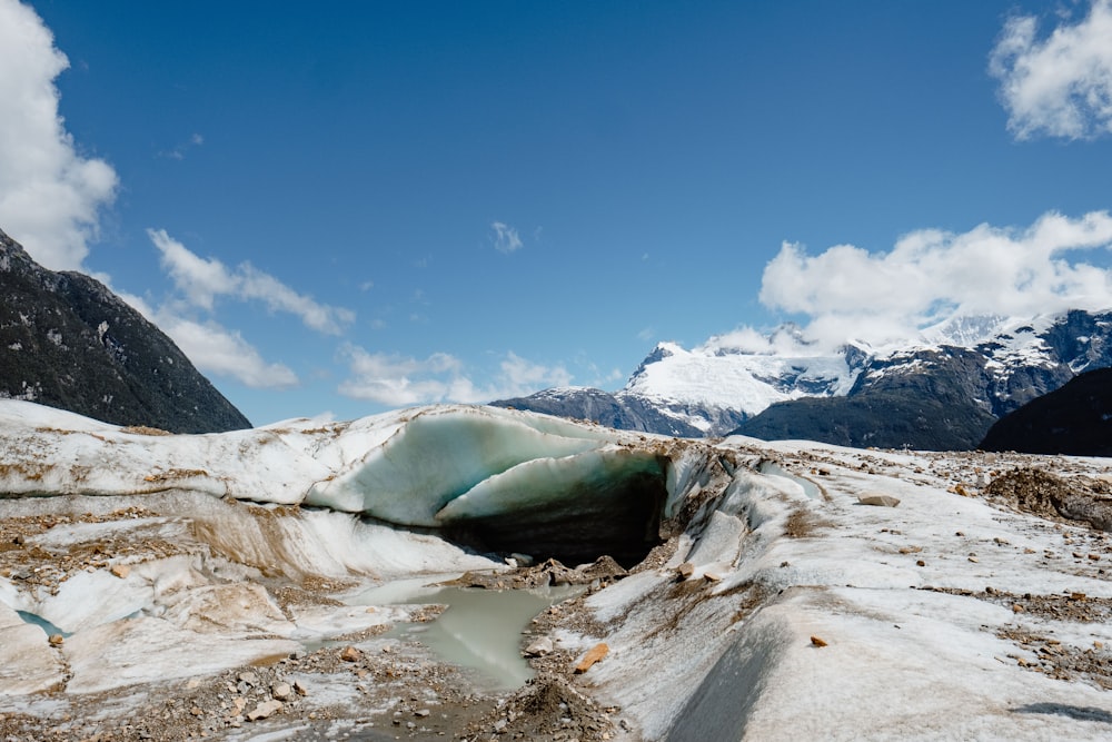 mountain covered by snow under clear blue sky