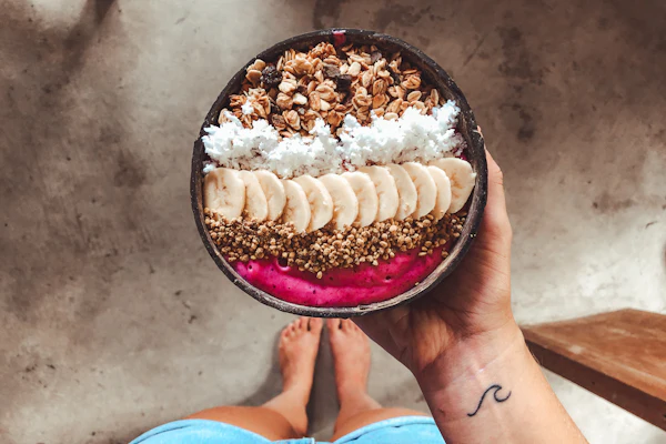Hands holding a smoothie bowl
