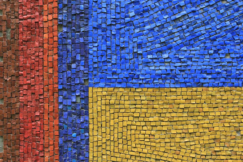 a close up of a wall made out of small tiles