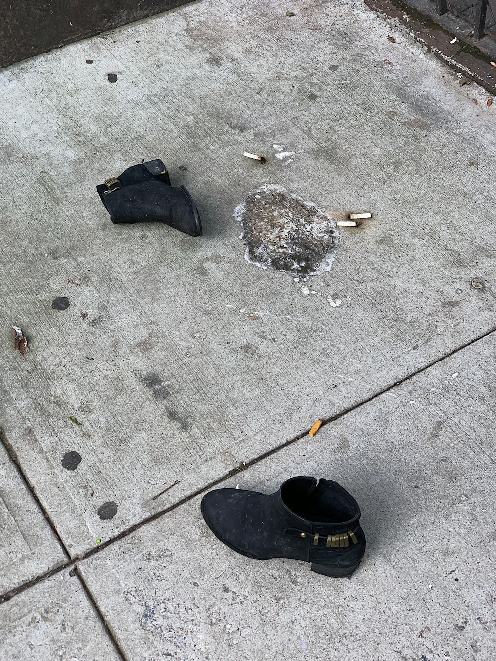 pair of black boots on floor