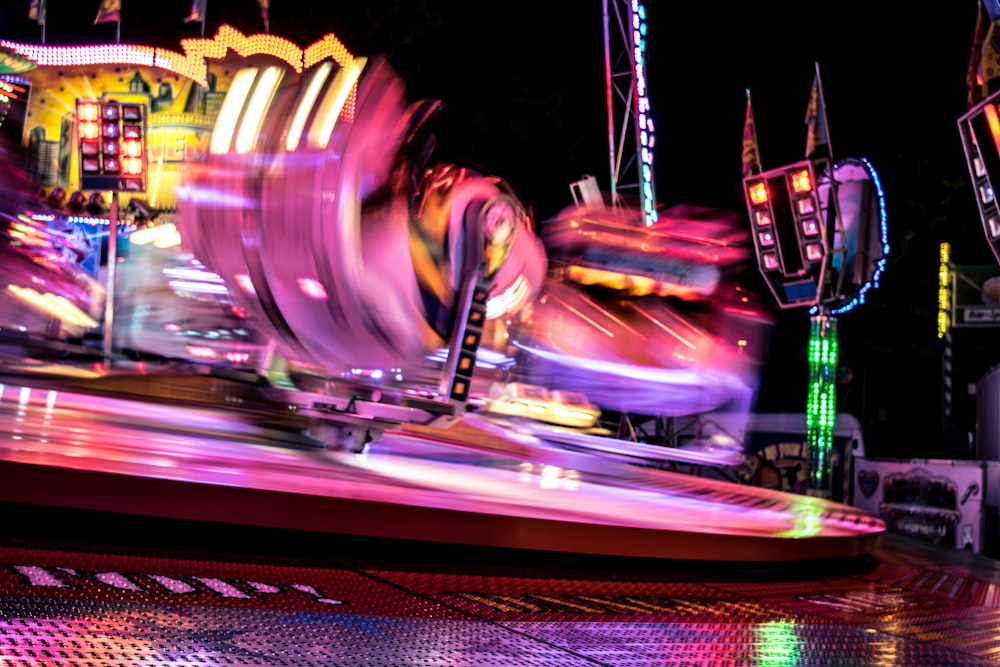 a carnival ride at night with a lot of lights