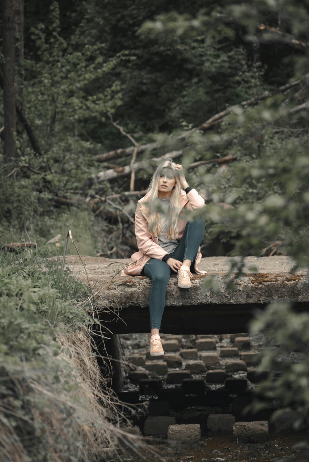 woman sitting near the plant