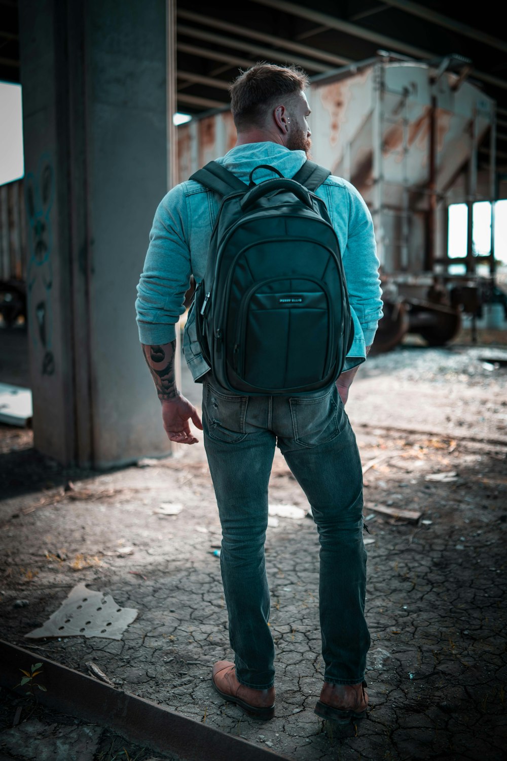 man in blue jacket with black jacket