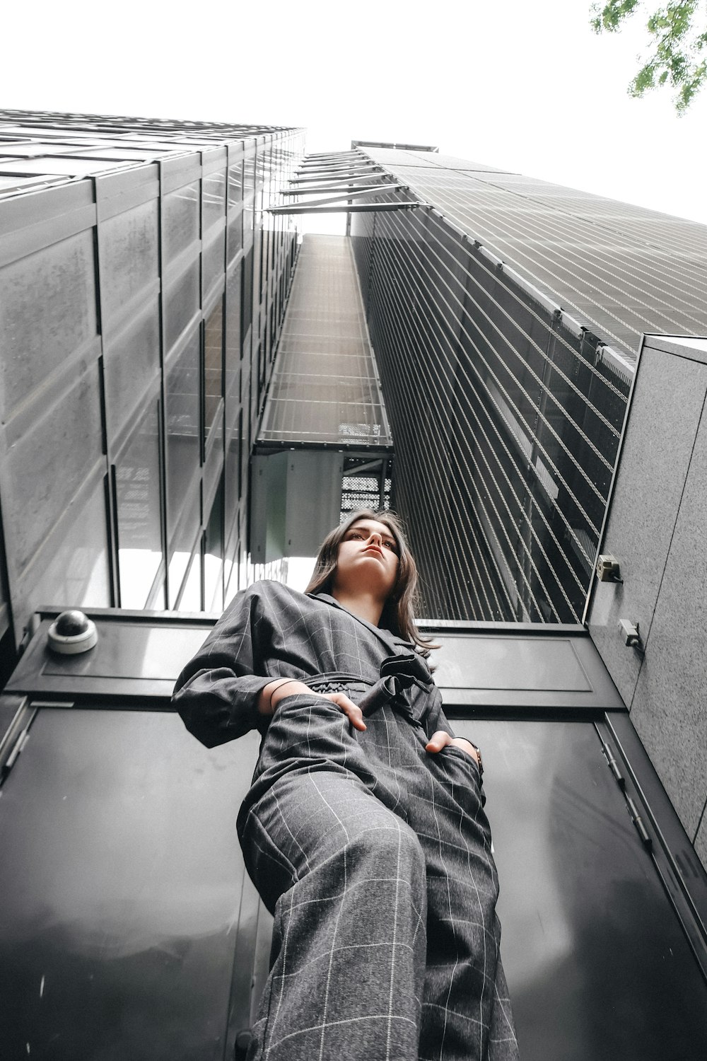 woman standing in front of high-rise building