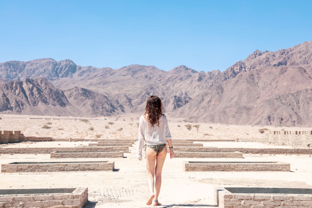 woman walking near mountain