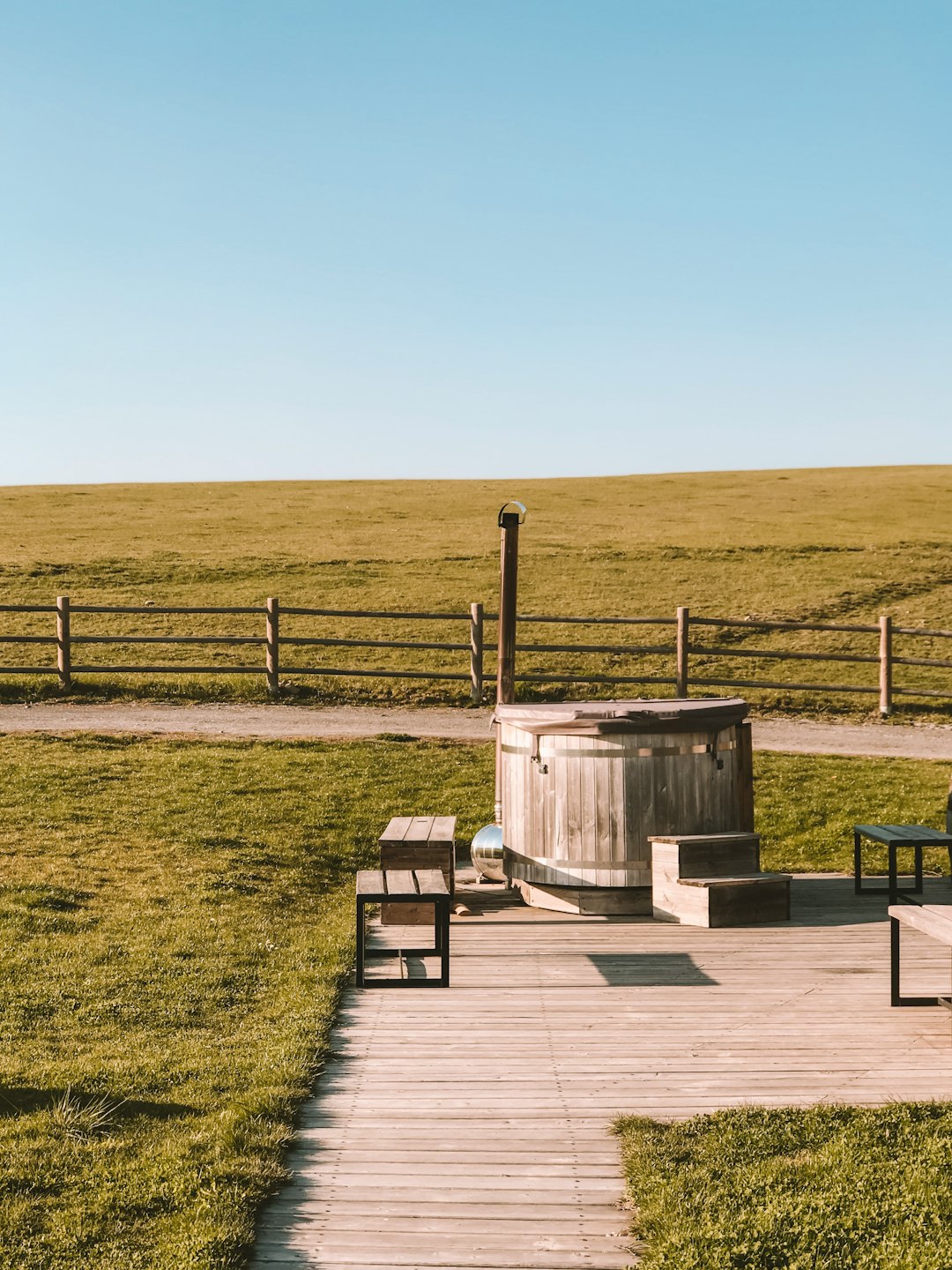 two brown wooden stools near grass field