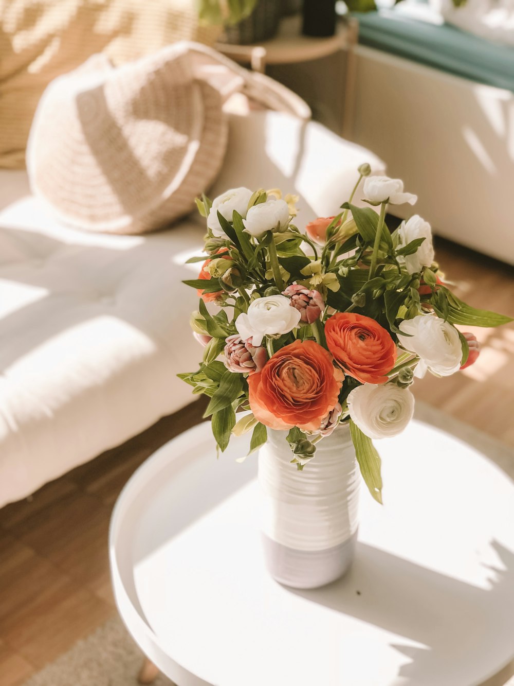 white and red flowers in vase