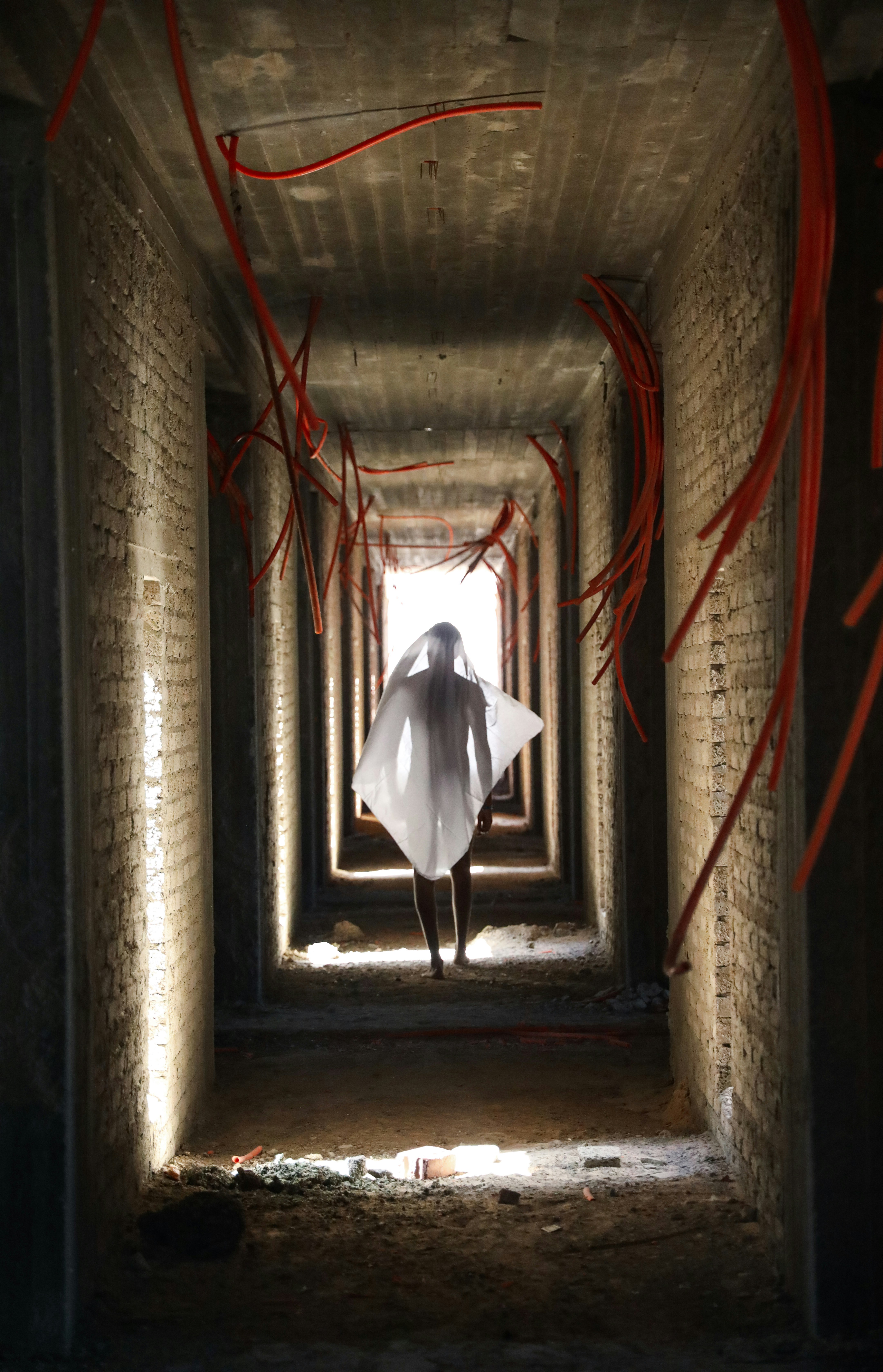 person walking on hallway inside building
