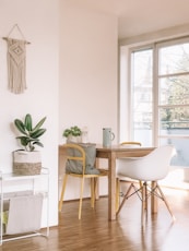 brown wooden armless chair and table in room