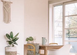 brown wooden armless chair and table in room